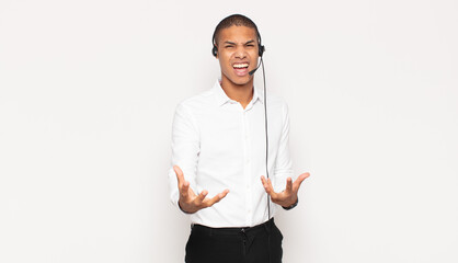 young black man looking angry, annoyed and frustrated screaming wtf or what’s wrong with you