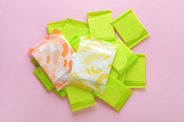 menstruation cycle, feminine hygiene and protection, sanitary pads on pastel pink background, top...