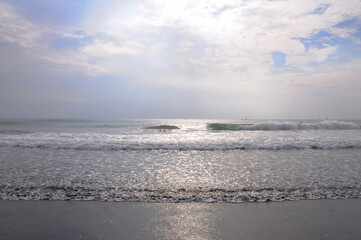 The beach against sunset sky.