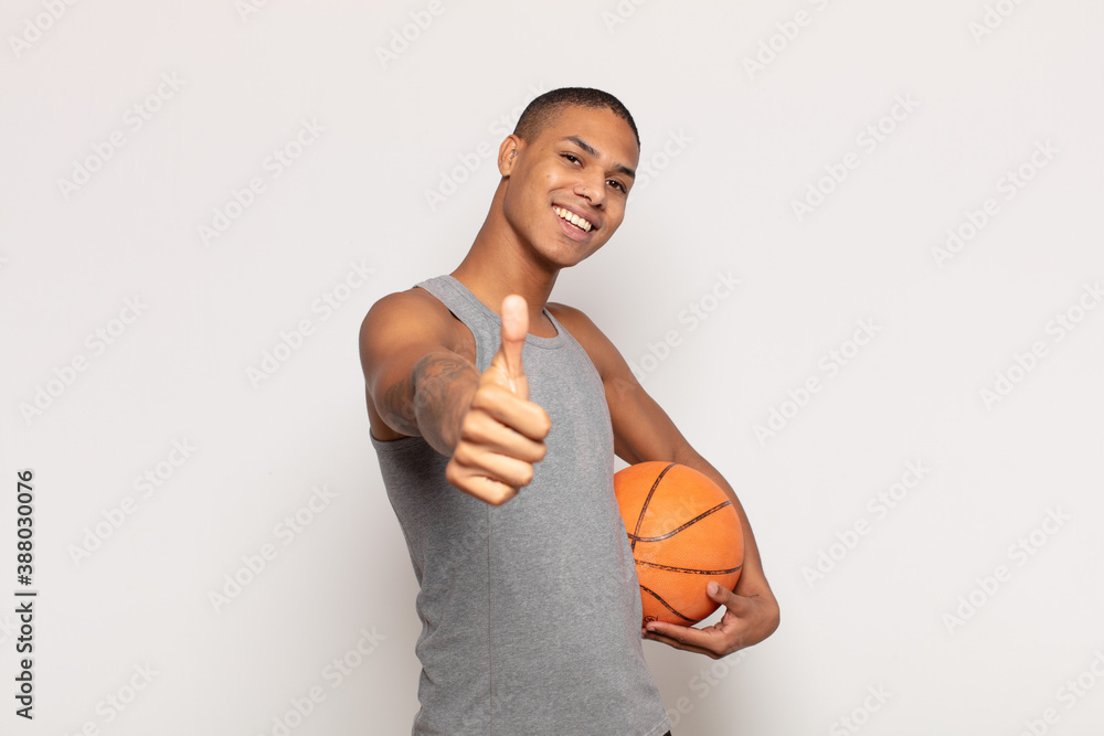 Sticker young black man feeling proud, carefree, confident and happy, smiling positively with thumbs up