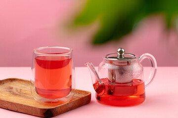 Glass teapot and cup with black tea