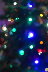 Colorful Christmas bokeh lights. Defocused Christmas background.