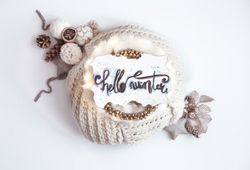 Winter composition Hello winter with decor and knitted element on white background top view.