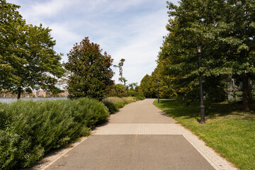 Fototapeta na wymiar Empty Trail along the Riverfront of Randalls and Wards Islands in New York City during Summer