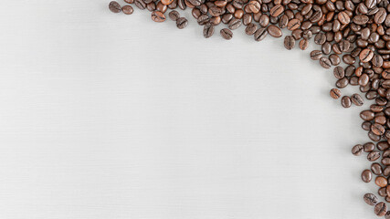 Top view roasted coffee beans on grey background with copy space, Concept coffe for backdrop design.