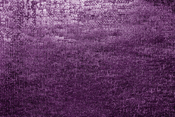 Glitterring and shimmering purple textile and fabric texture.