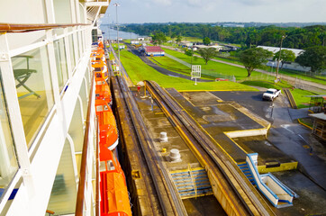 Almost no space between modern cruiseship or cruise ship liner and concrete walls of Panama Canal...