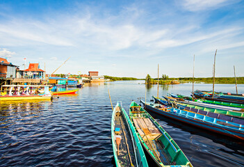 Fototapeta na wymiar Wooden boat in Sebangau River, Transportation to Sebangau National Park in Palangka Raya, Central Kalimantan, Indonesia.