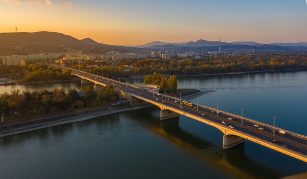 Budapest, Hungary - aerial view of Arpad Bridge at autumn sunset with buda hills at the background