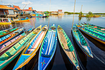 Fototapeta na wymiar Wooden boat in Sebangau River, Transportation to Sebangau National Park in Palangka Raya, Central Kalimantan, Indonesia.