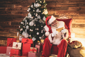 Real Santa Claus reading letters from kids.