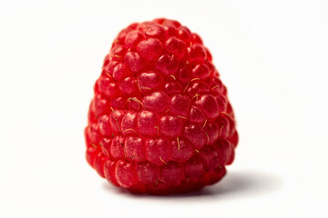 Fresh ripe raspberries on a white background - berry close-up. Homemade berry isolated.