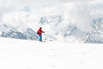 Fototapeta na wymiar North Caucasus, skier in the mountains against the snow in winter,