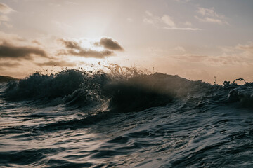 waves crashing with sunrise 