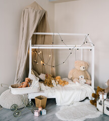 Baby cot in beige color. Children's room interior design in new Year's style