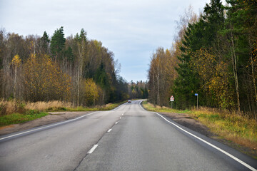 Road in autumn landscape. Tver region, Russia
