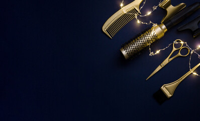 Banner with Barber tools and holiday lights. Gold hair salon accessories on a dark blue background.