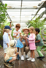 diverse kindergarten children get to know the world around them, the greenhouse is a great place for an excursion, look, learn