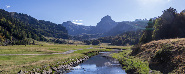 Fototapeta na wymiar Pyrenees mountains with small river in Ossau valley, Pyrenees National Park, France