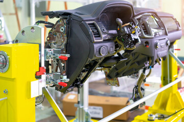 View of car's internal panel (IP) on supply dolly in car assembly factory.