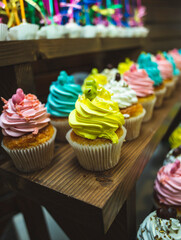 Tasty sweet tartlets with cream. Tasty sweet tartlets with colorful cream. Cupcake in pastry basket with delicate colored cream.