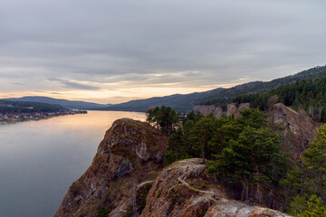 On a warm autumn evening in the vicinity of krasnoyarsk, on the karaul bull's rock, it is pleasant to admire the sunset over Yenisei.