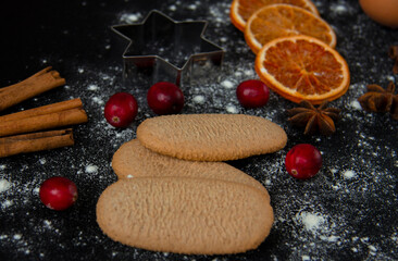 Christmas Baking background. Ingredients for cooking christmas baking on dark stone or metal background.