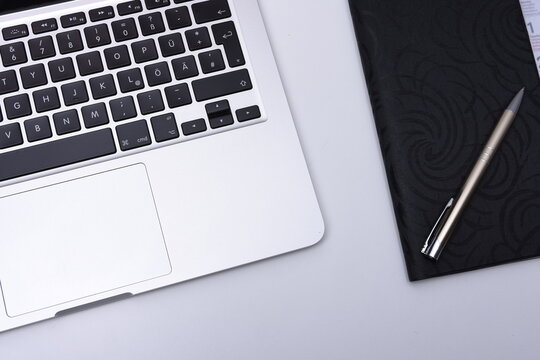 Laptop on desck with pen and map for business

