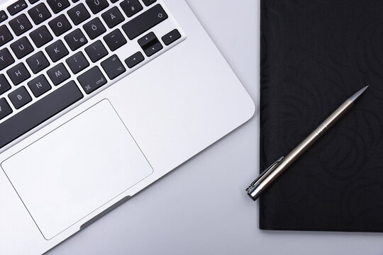 Laptop on desck with pen and map for business
