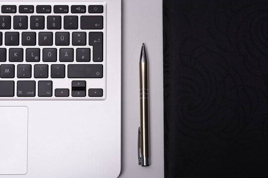 Laptop on desck with pen and map for business

