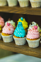 Tasty sweet tartlets with cream. Tasty sweet tartlets with colorful cream. Cupcake in pastry basket with delicate colored cream.