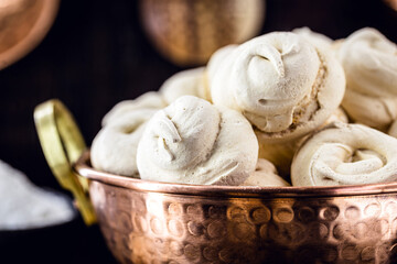 copper pot with homemade cookies, sighs, also called merengue, Brazilian and French cuisine