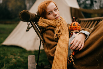 Young girl lying in a village hindcarriage