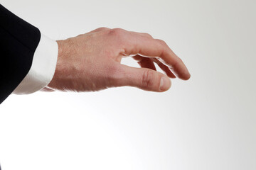 Male hand turned down in front of white background