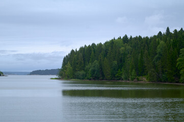 Summer landscape with lake, hills and forest