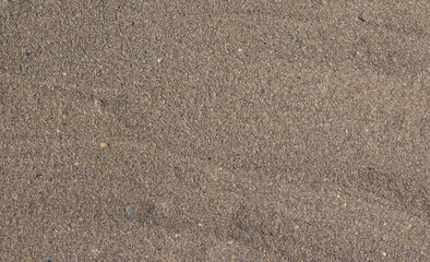 The texture of the beach of sand and small pebbles