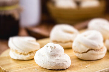 Fototapeta na wymiar breakfast or afternoon snack. Homemade cookies called sighs or meringue