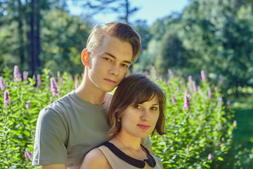 Fototapeta premium Young man and woman have date in park.