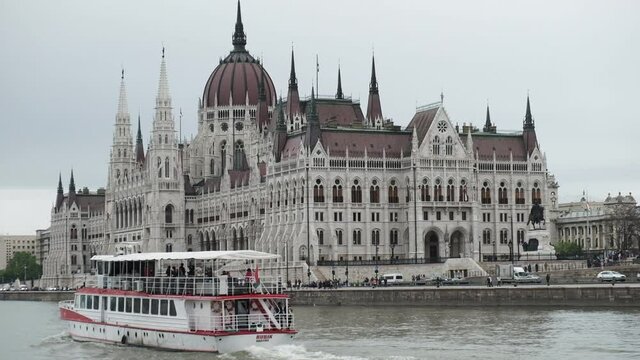Budapest Parliament from the river side, with a boat on the front, filmed from a boat. 

Hungary, Budapest