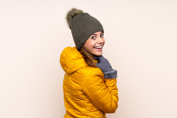 Woman with winter hat over isolated background