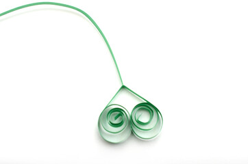 Green heart of paper quilling with tail