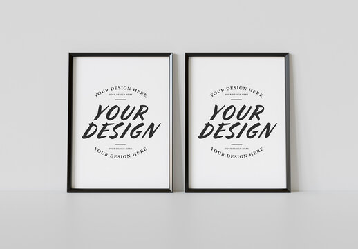 Two Black Frames Leaning on White Wall Mockup