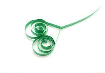 green origam paper quilling heart on white