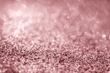Abstract rose gold glitter sparkle texture with bokeh background
