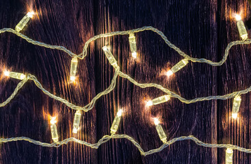 Christmas garland with warm white led and transparent wire от dark wood board