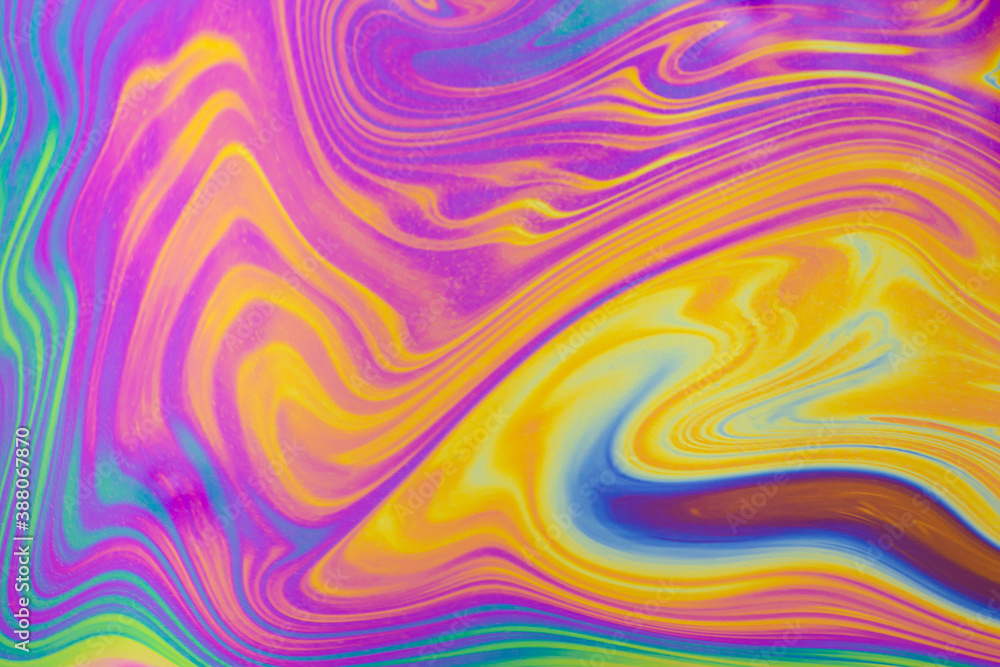 Wall mural psychedelic multicolored patterns background. photo macro shot of soap bubbles
