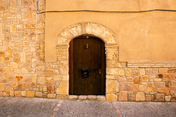 Old wood door from a medieval town in Spain.