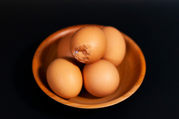 Egg chicken on Plate brown and dark background.