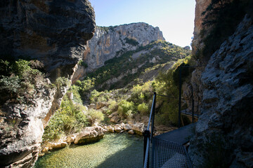 Ruta de las pasarelas, Alqu&eacute;zar. Beautiful route across the river crossing metal walkways and nature trails through the mountain.