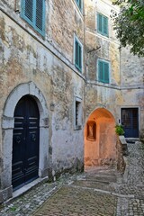 A narrow street among the old stone houses of Castro dei Volsci, a medieval village in the province of Frosinone in Italy.